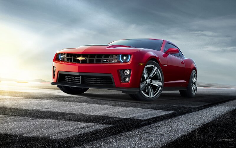 Red Chevrolet Camaro on racetrack
