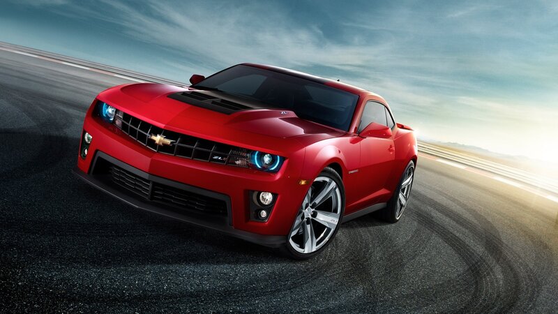 Red Chevrolet Camaro on racetrack