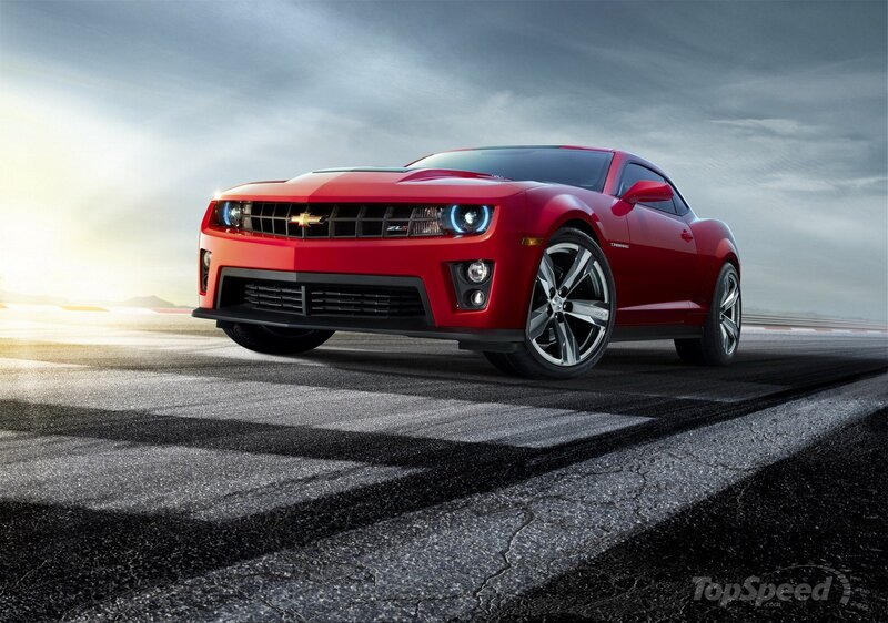 Red Chevrolet Camaro on racetrack