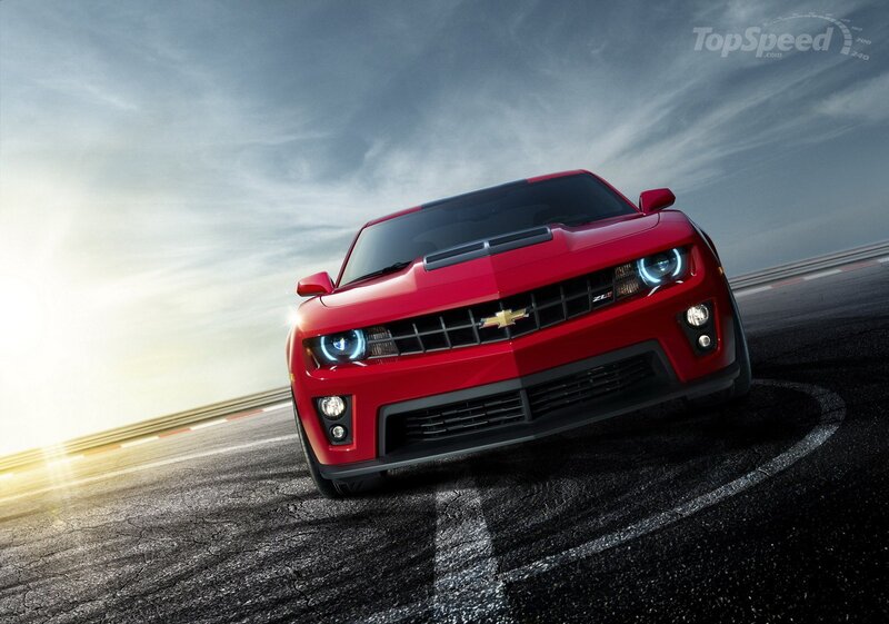 Red Chevrolet Camaro on racetrack