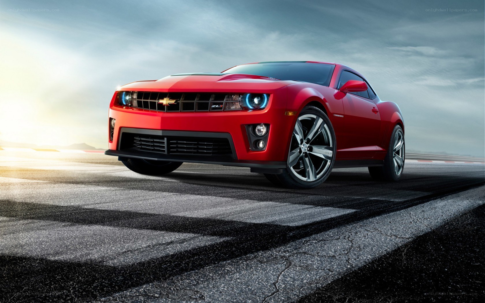 Red Chevrolet Camaro on racetrack