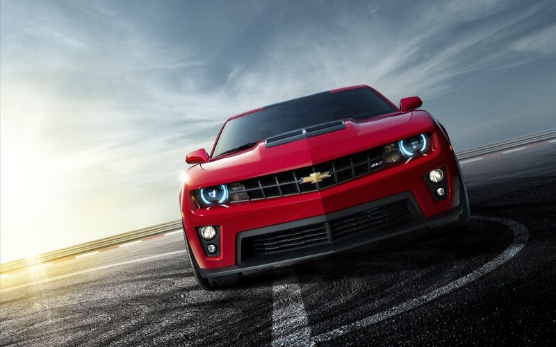 Red Chevrolet Camaro on racetrack