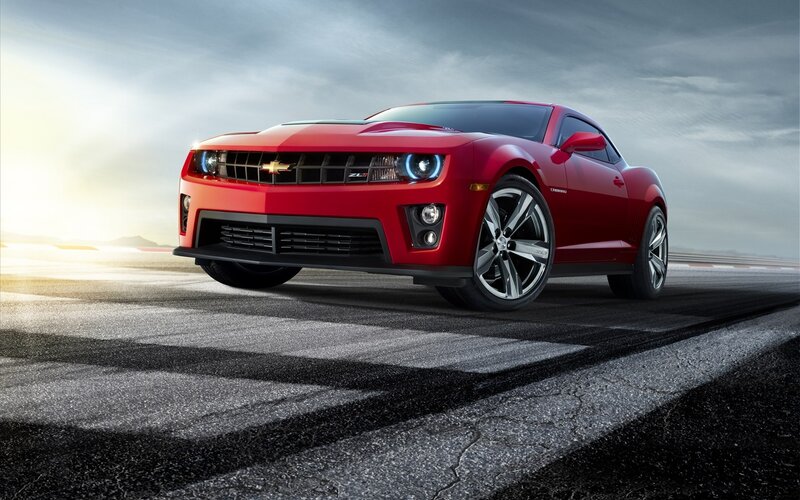 Red Chevrolet Camaro on racetrack