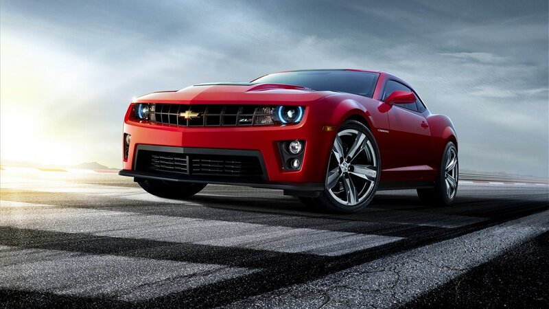 Red Chevrolet Camaro on racetrack