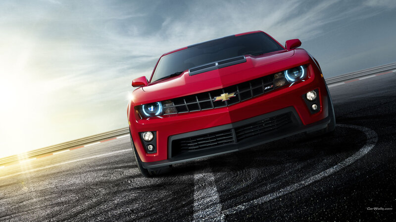 red chevrolet camaro on racetrack