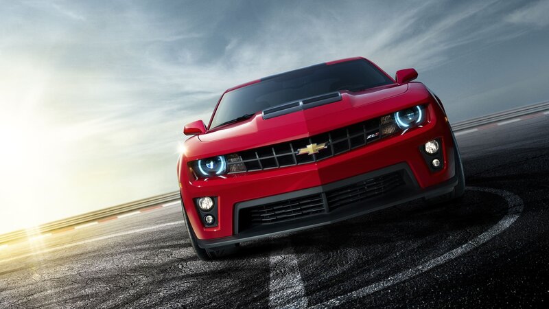 Red Chevrolet Camaro on racetrack