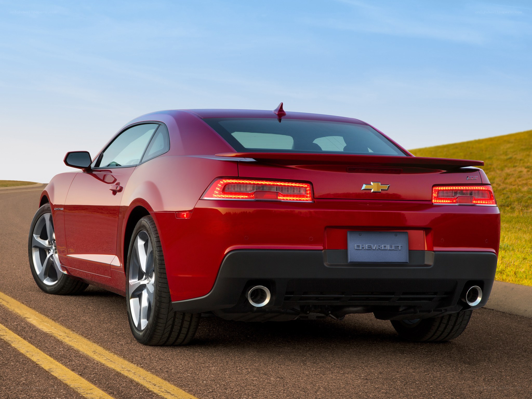 Red Chevrolet Camaro on road