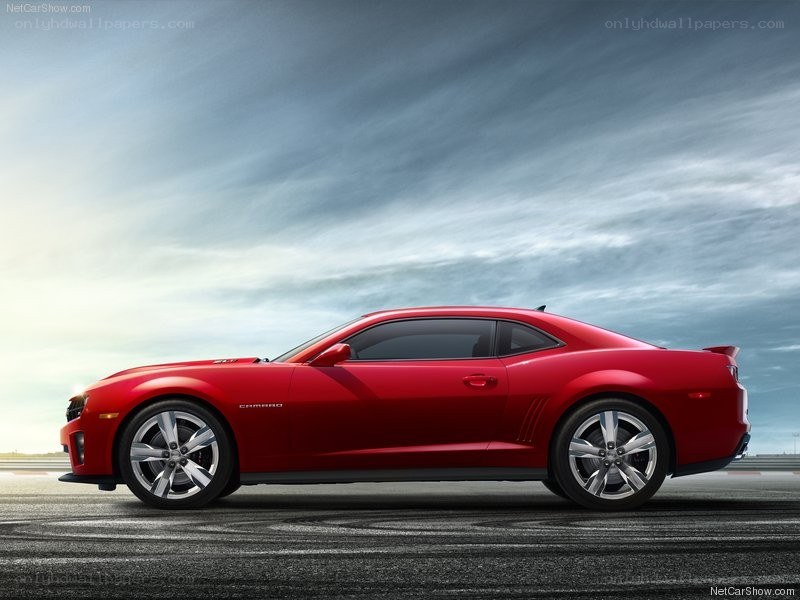 Red Chevrolet Camaro on track