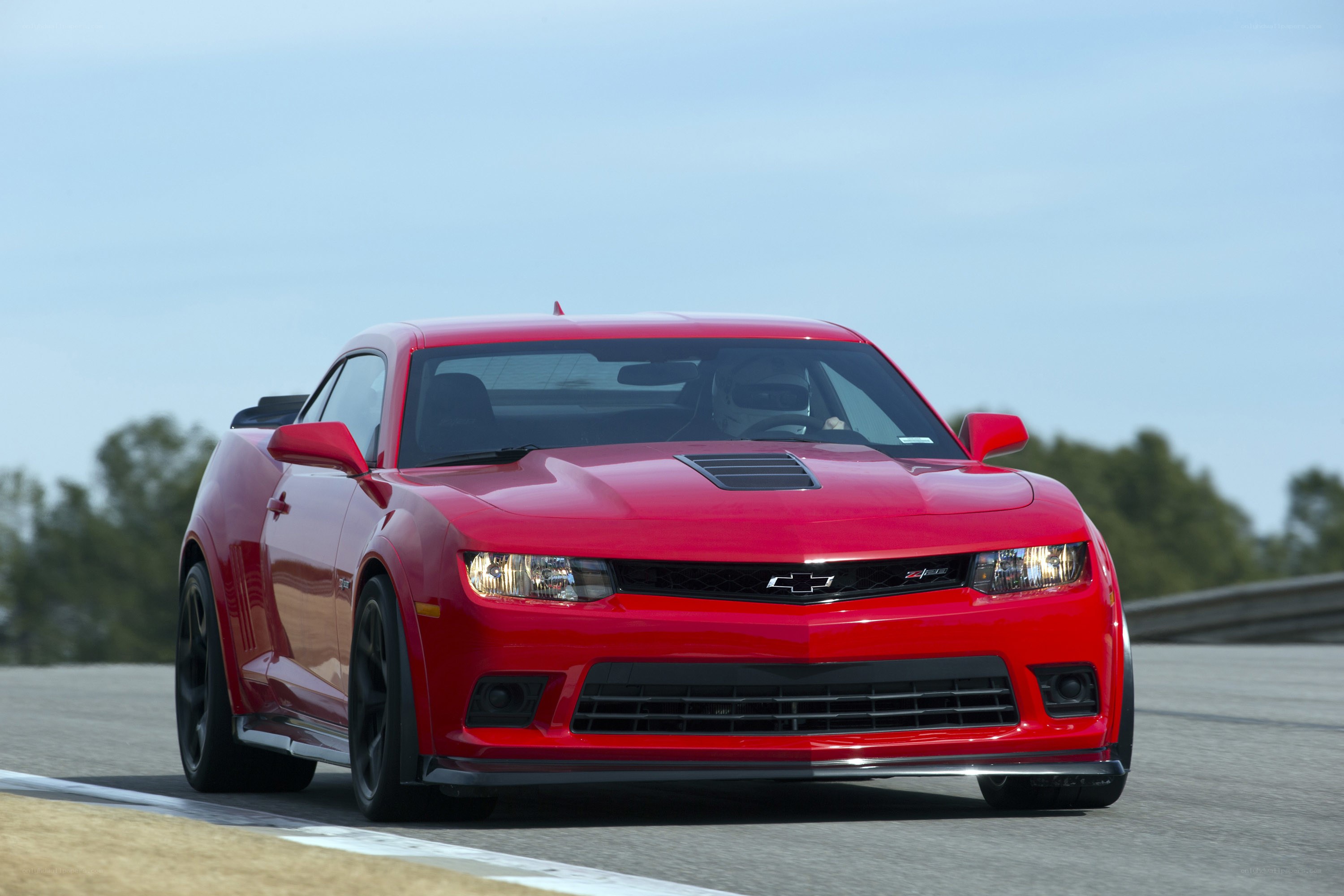 Red Chevrolet Camaro on track