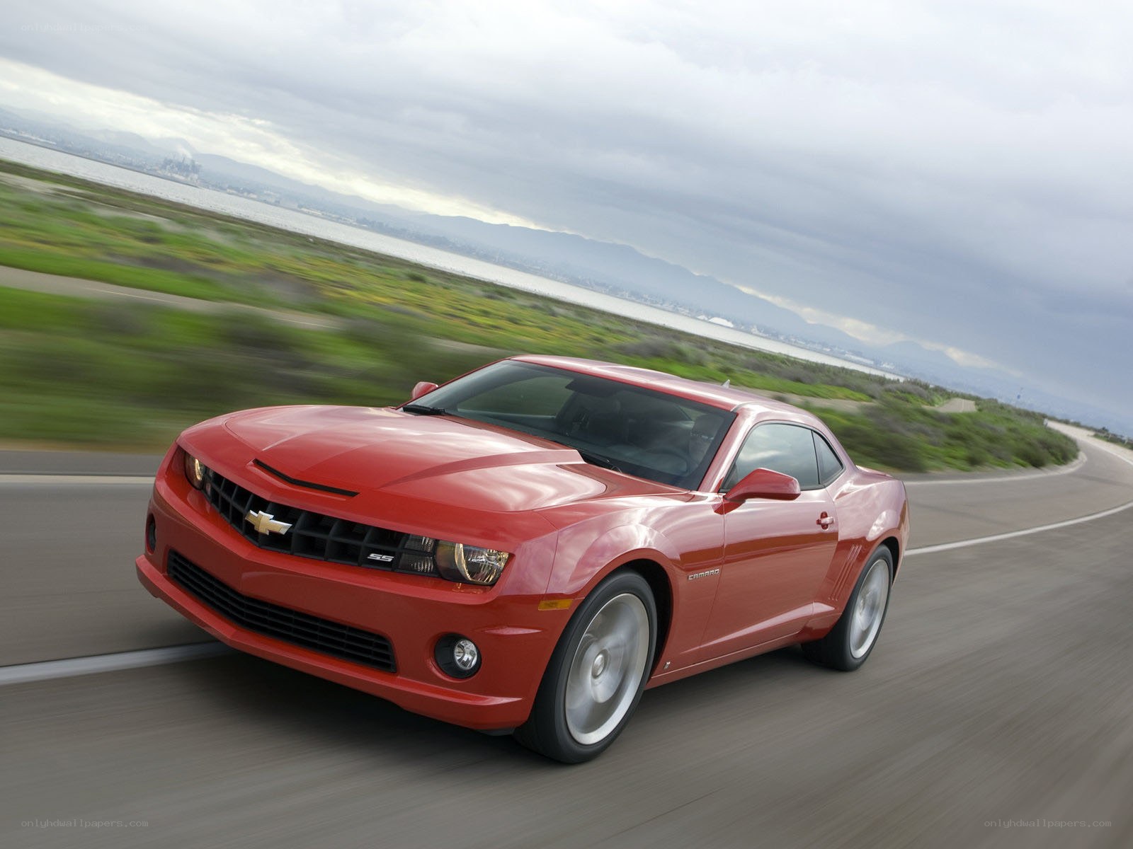 Red Chevrolet Camaro SS driving