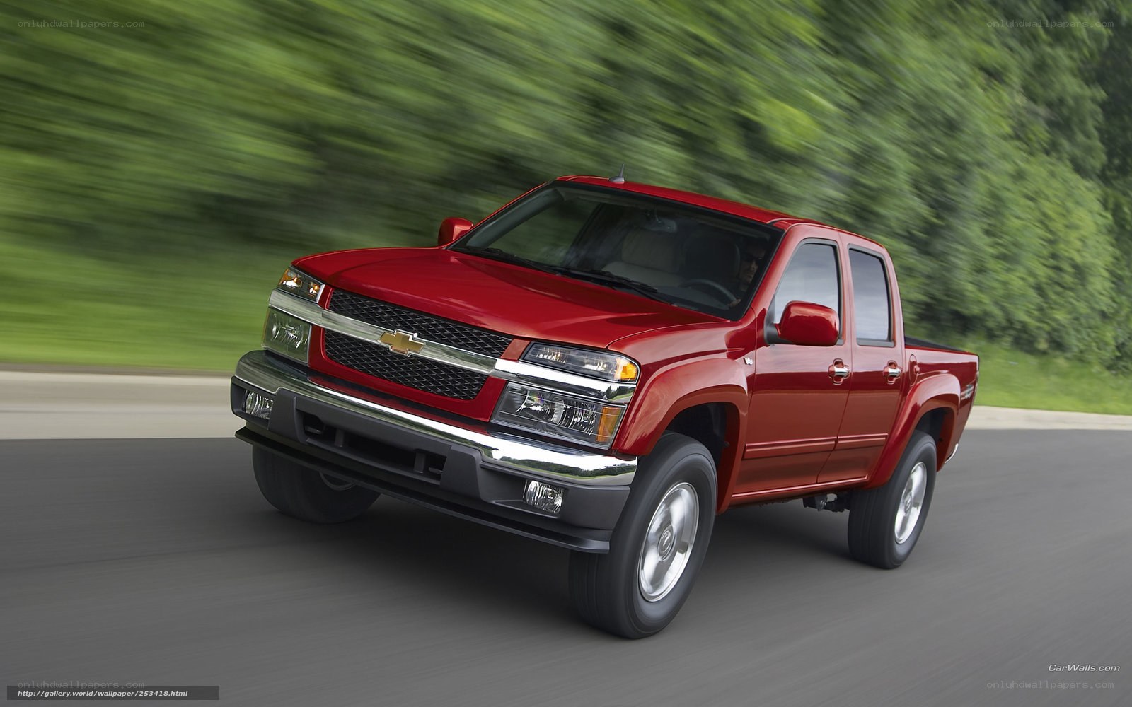Red Chevrolet Colorado in motion