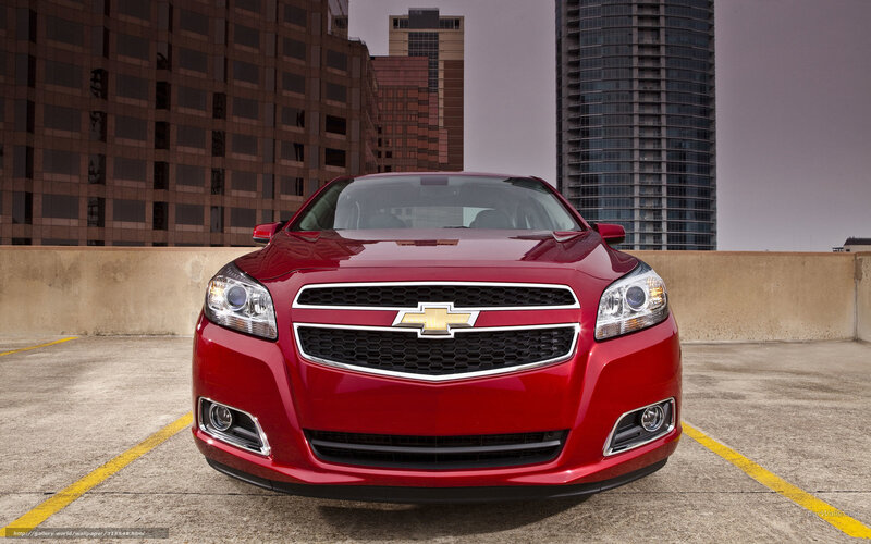 Red Chevrolet Malibu in city