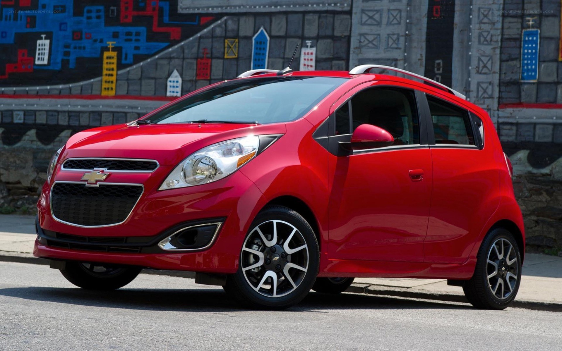 Red Chevrolet Spark compact car