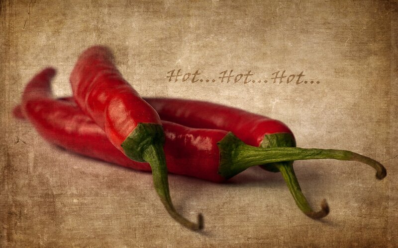 Red chili peppers on vintage background
