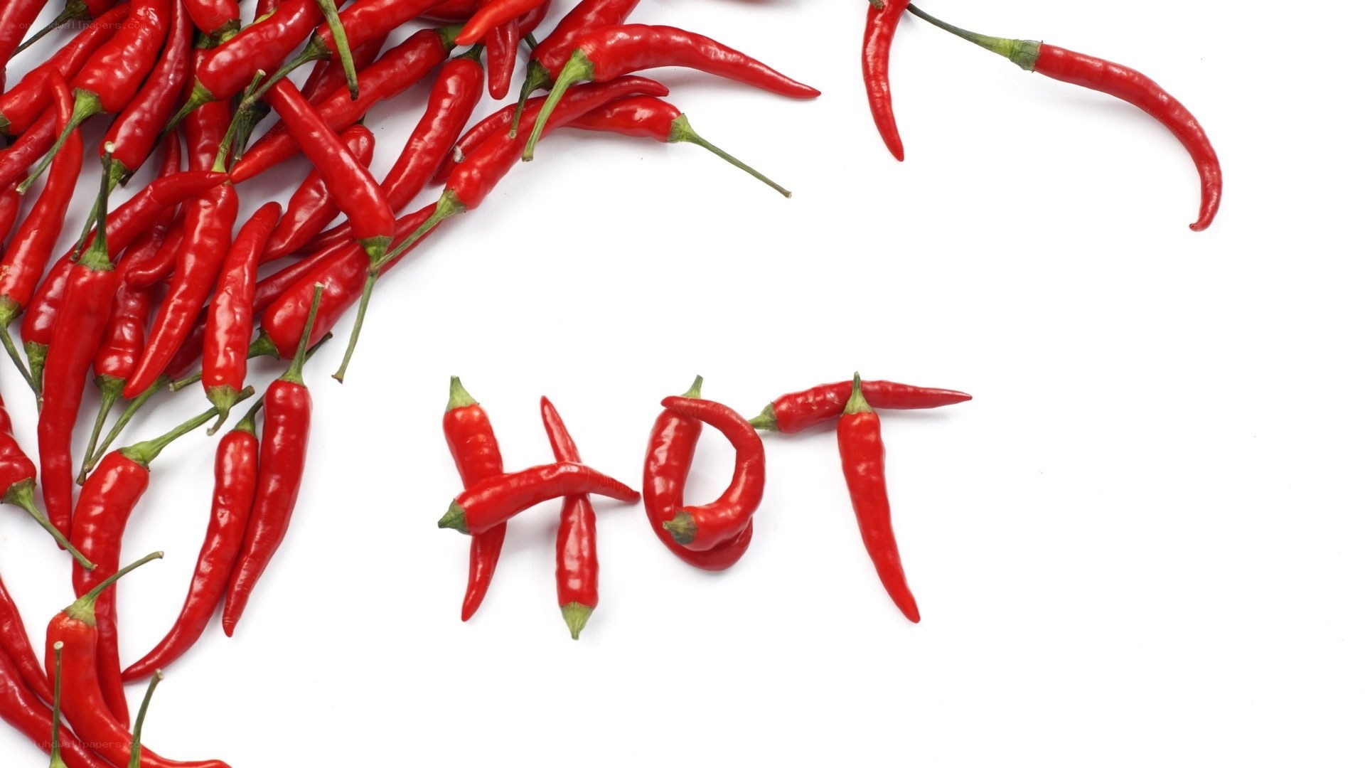Red chili peppers spelling hot