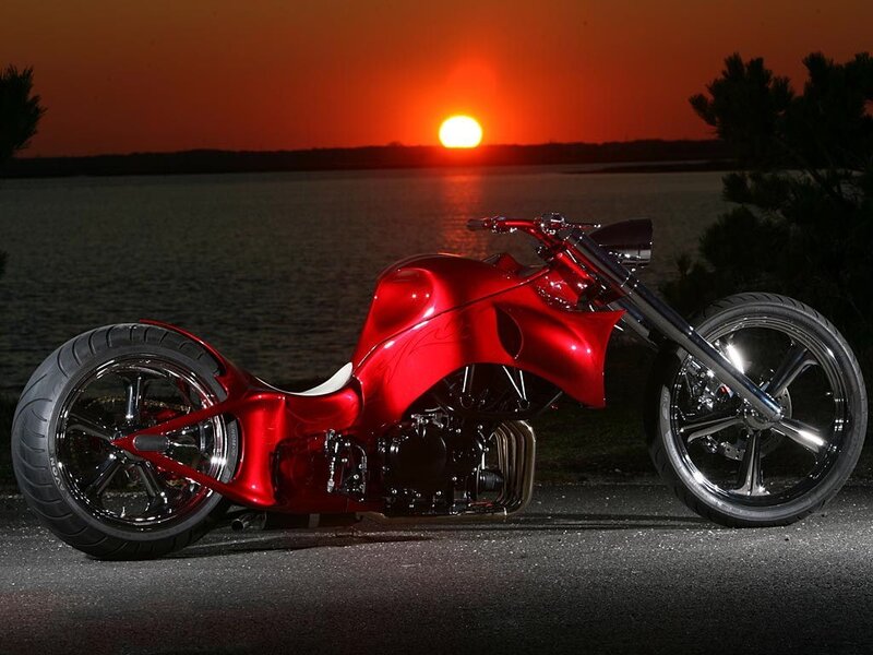 Red chopper motorcycle at sunset