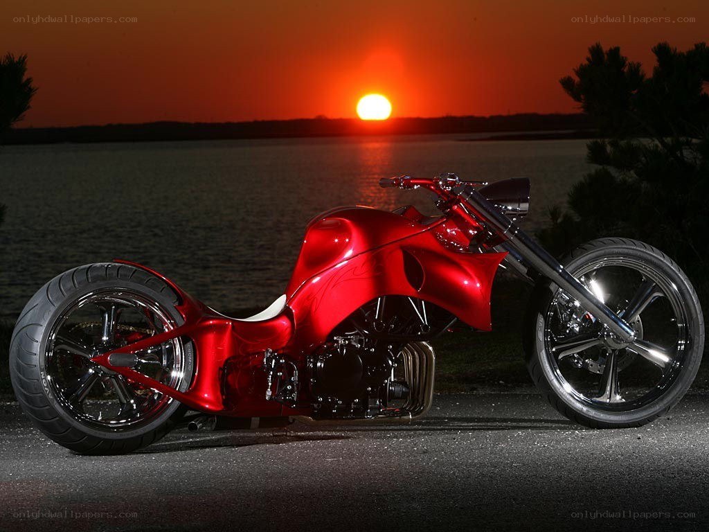 Red chopper motorcycle at sunset