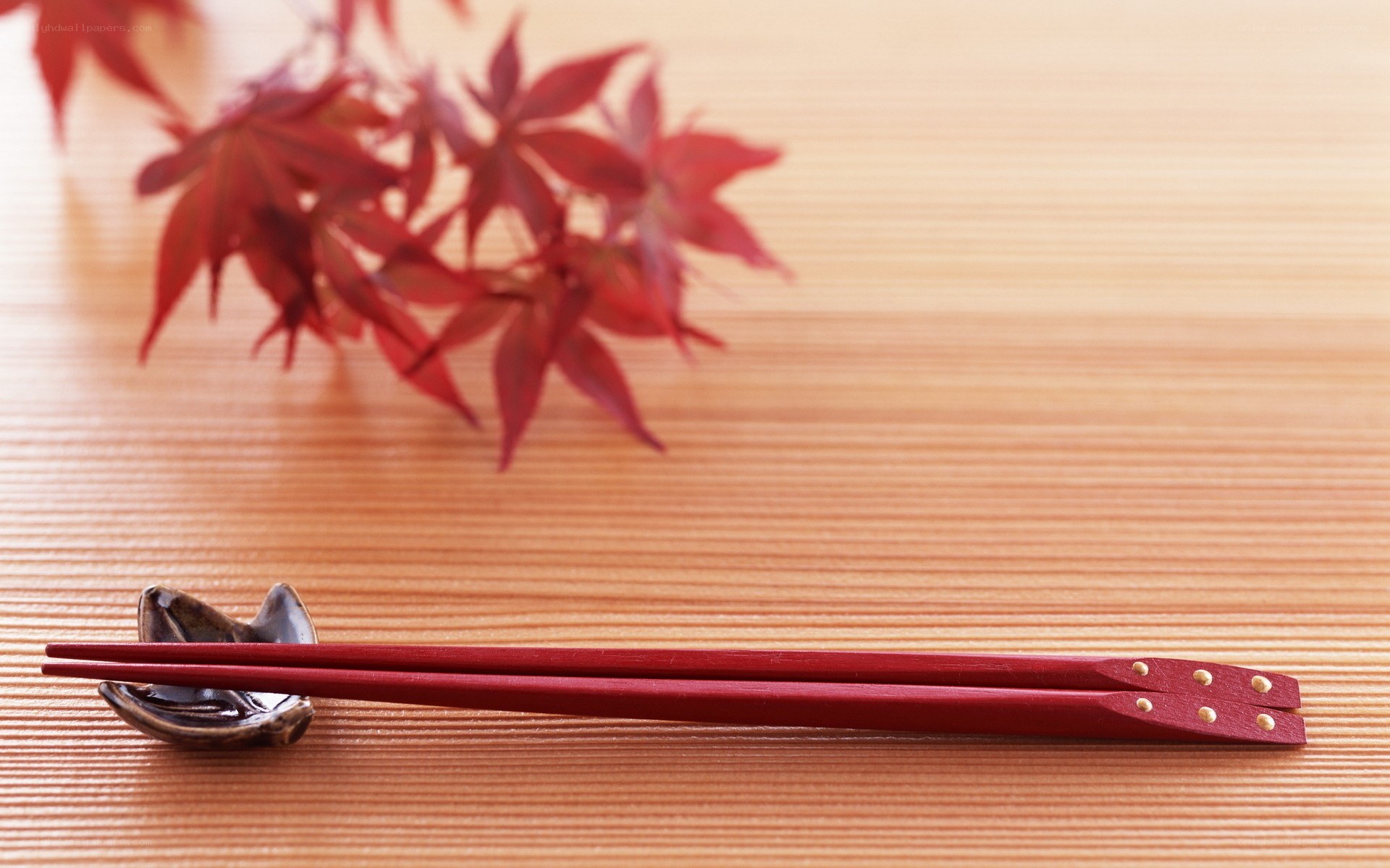 Red chopsticks on wooden table