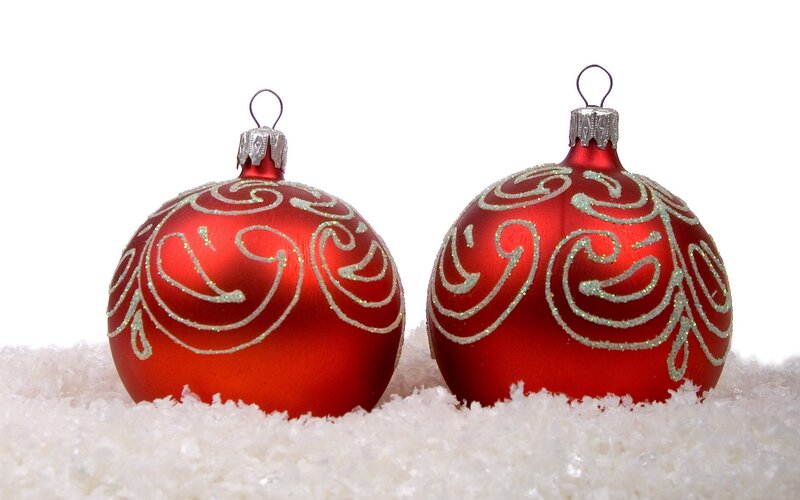 red christmas ornaments on snow