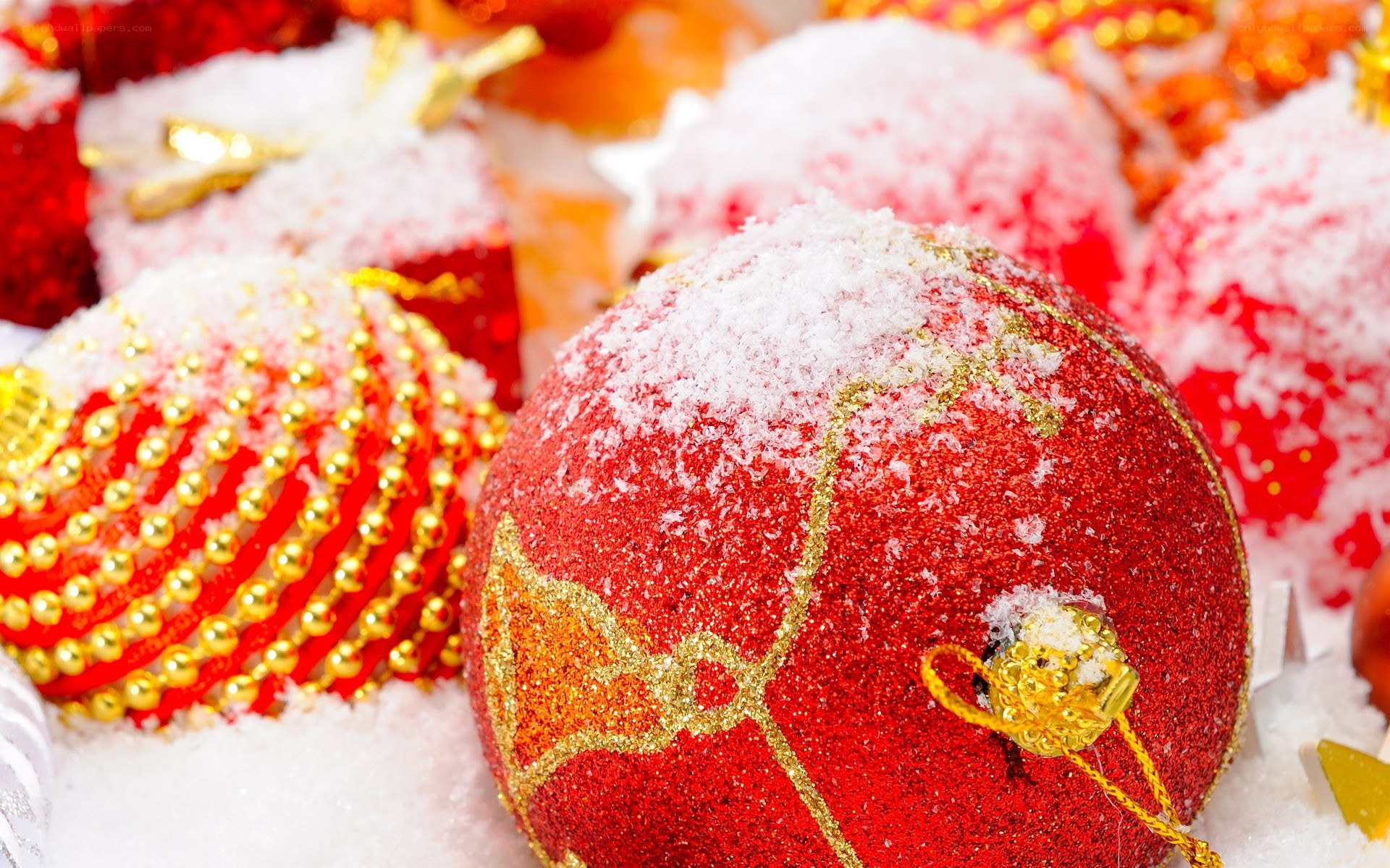 Red Christmas ornaments with snow