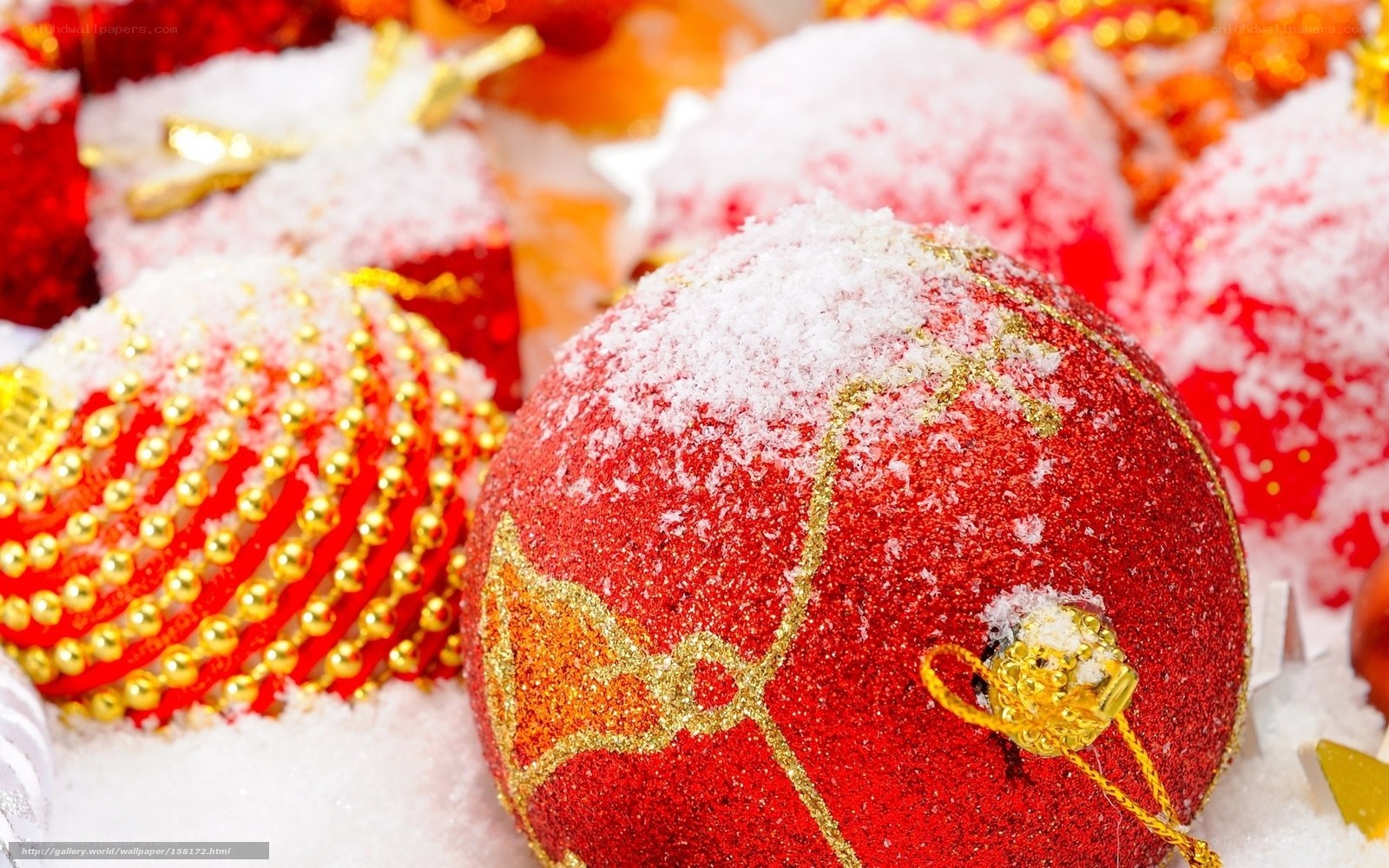 Red Christmas ornaments with snow