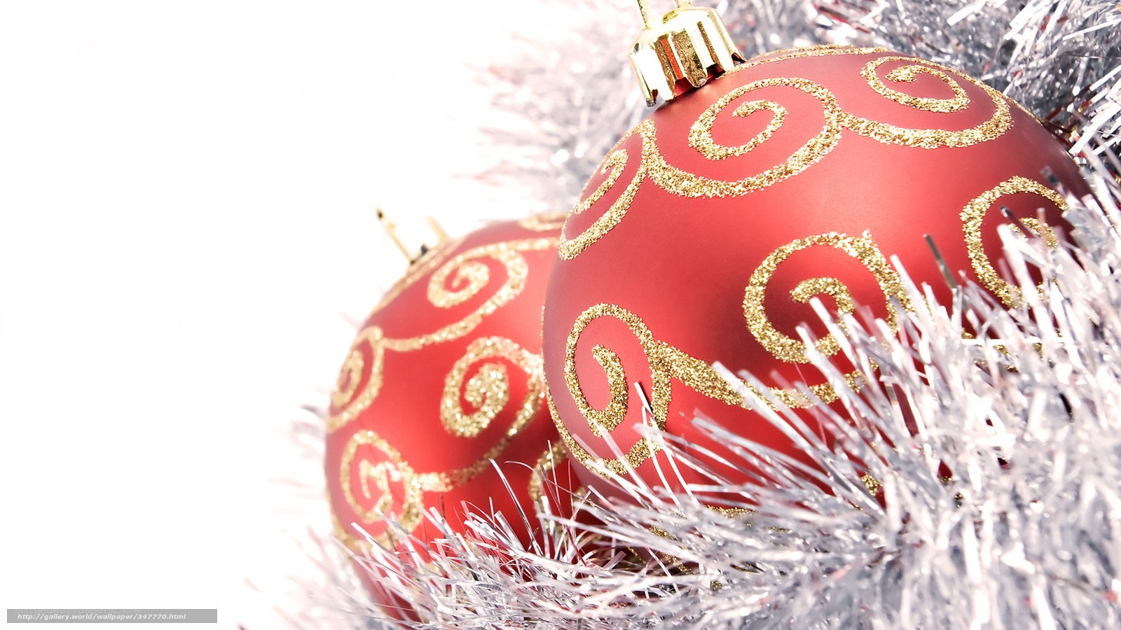 Red Christmas ornaments with tinsel