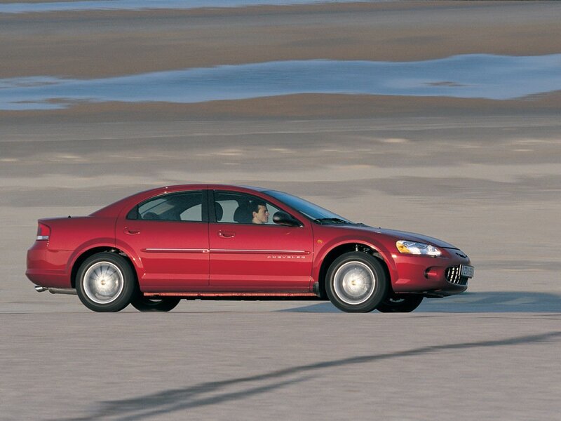 red chrysler sebring driving