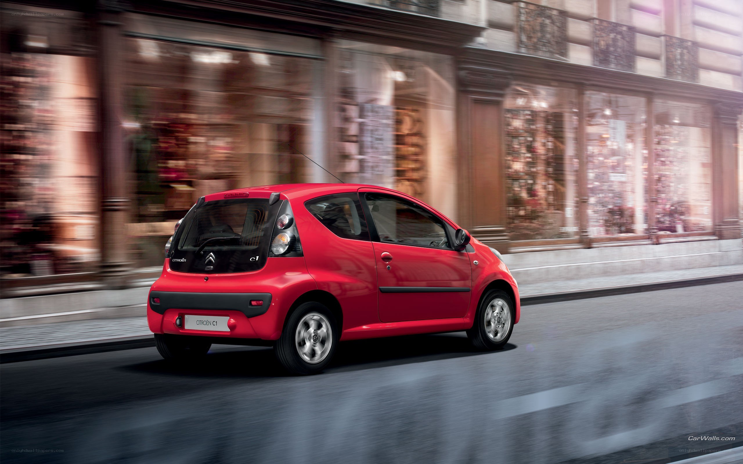 Red Citroën C1 in motion