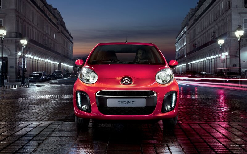 Red Citroën C1 on city street