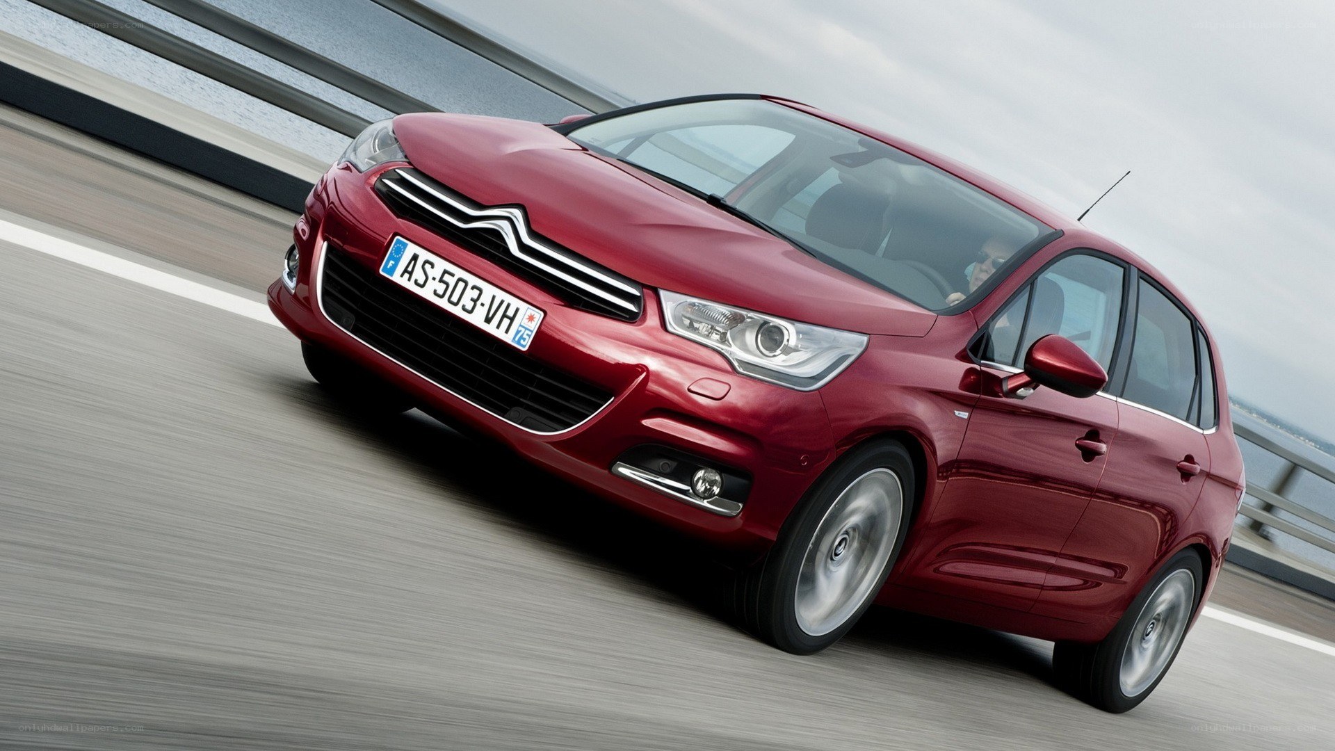 Red Citroën C4 Picasso in motion