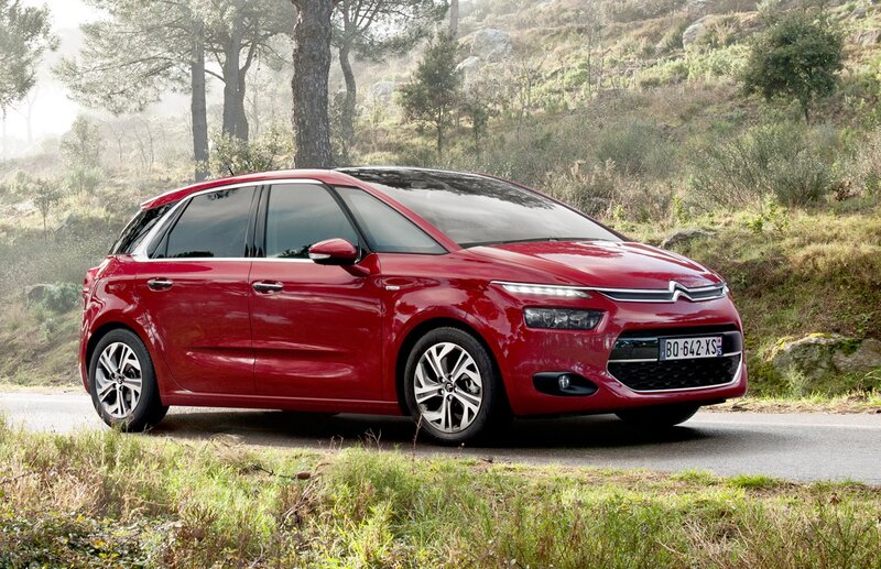 Red Citroën C4 Picasso on a country road