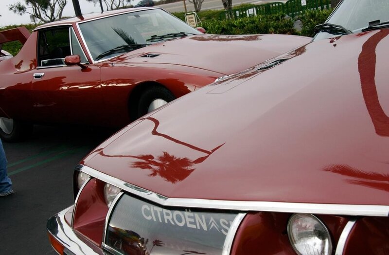 Red Citroën cars at a show