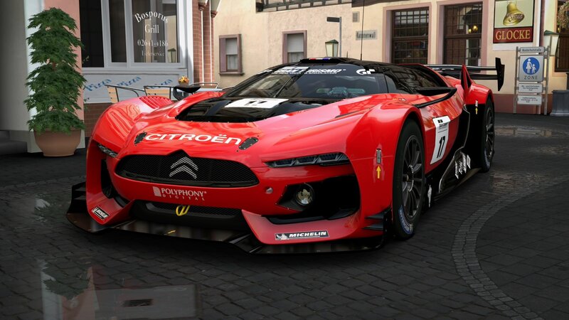 Red Citroën race car on cobblestones