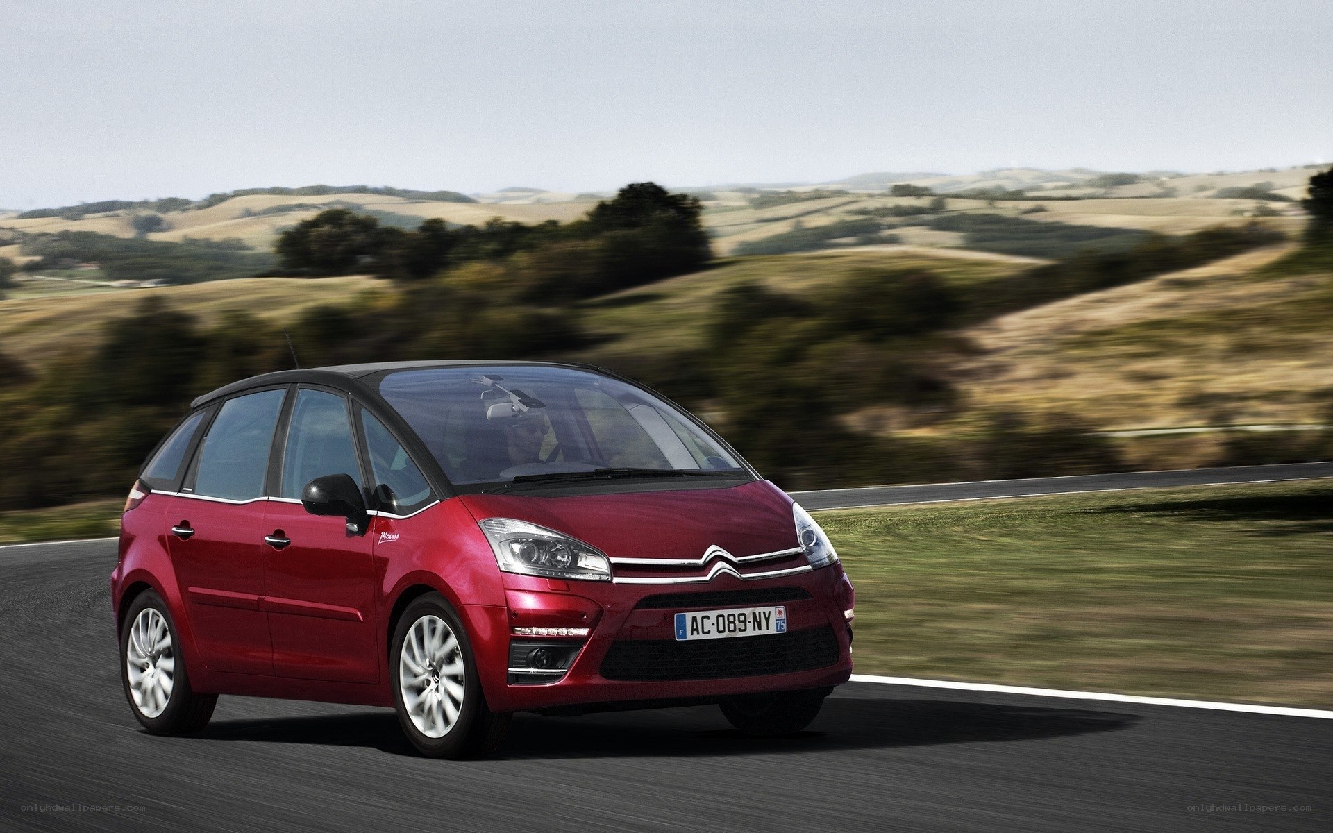 Red Citroen C4 Picasso in motion