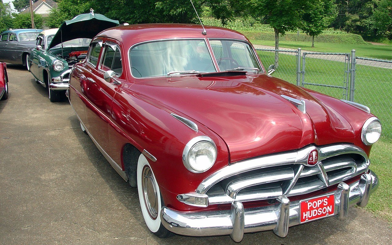 Red classic car at a show