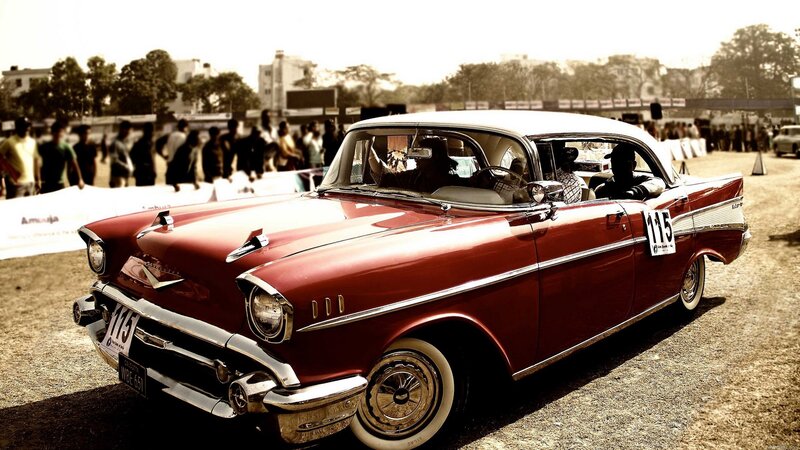 Red classic car at a show