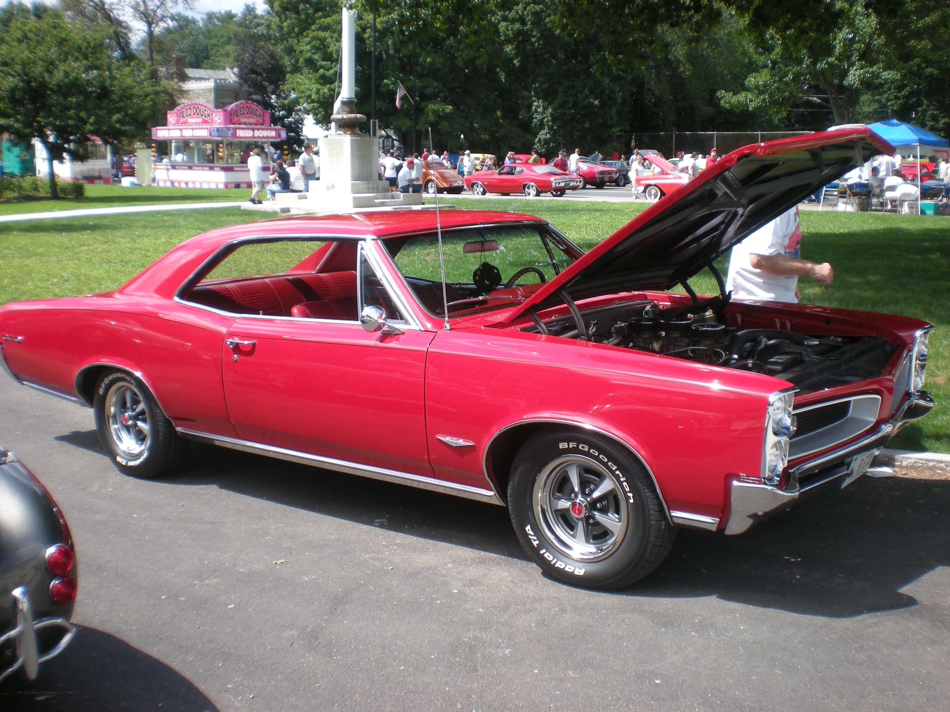 Red classic car at a show