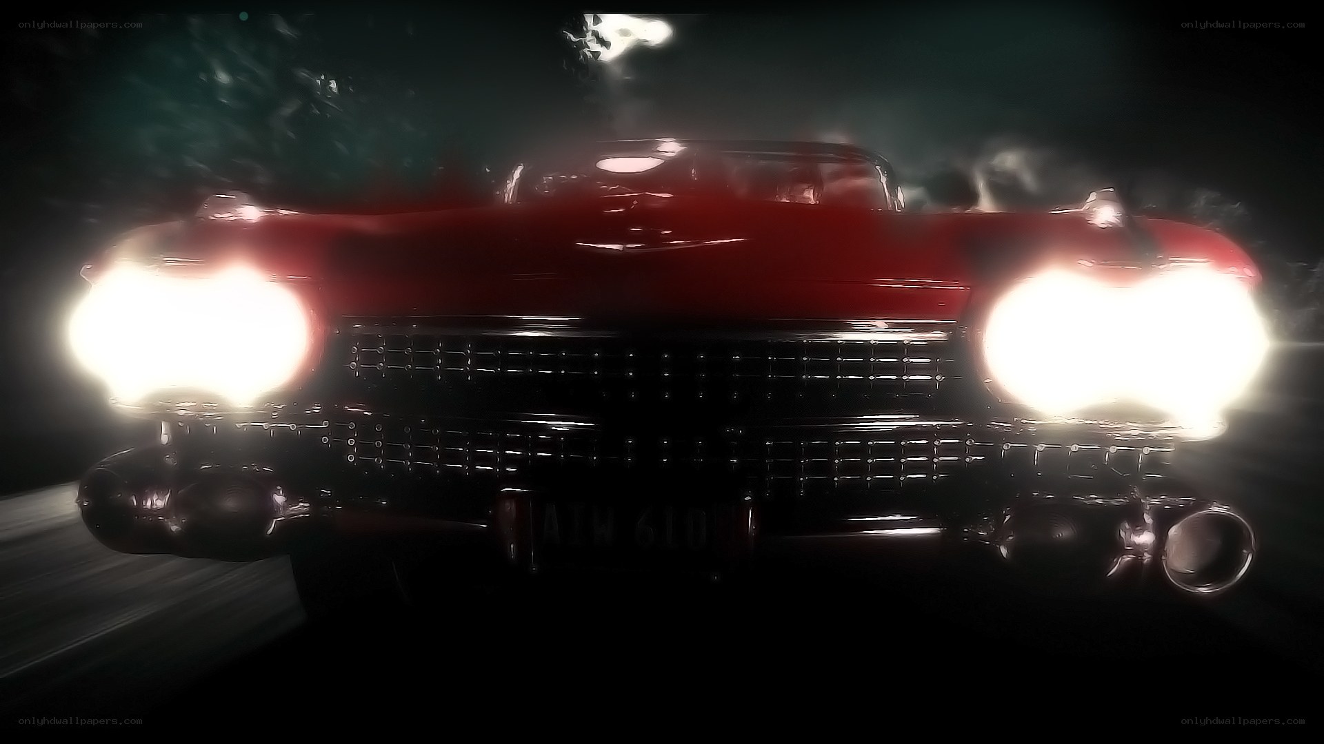 Red classic car at night