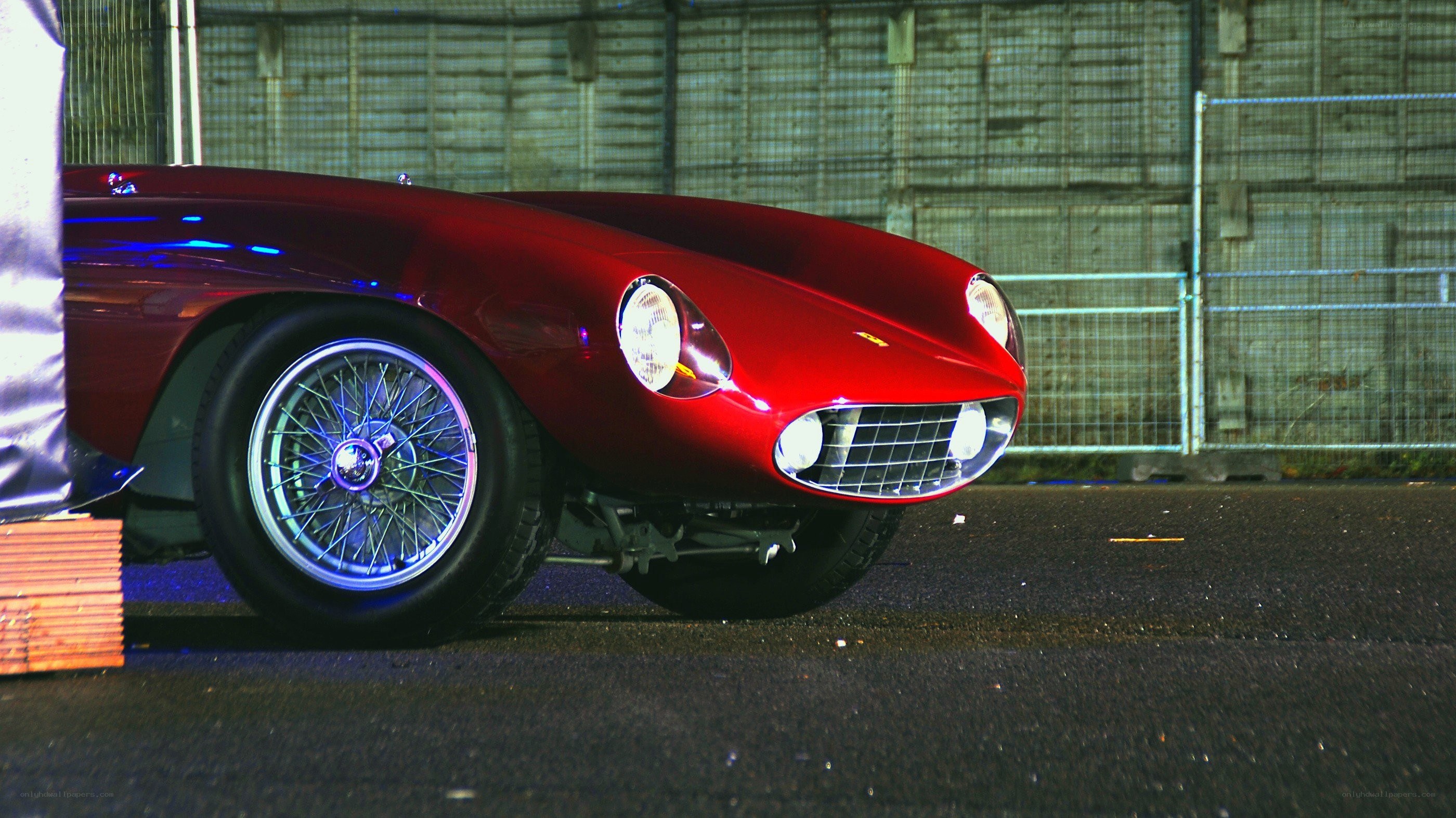 Red classic car at night