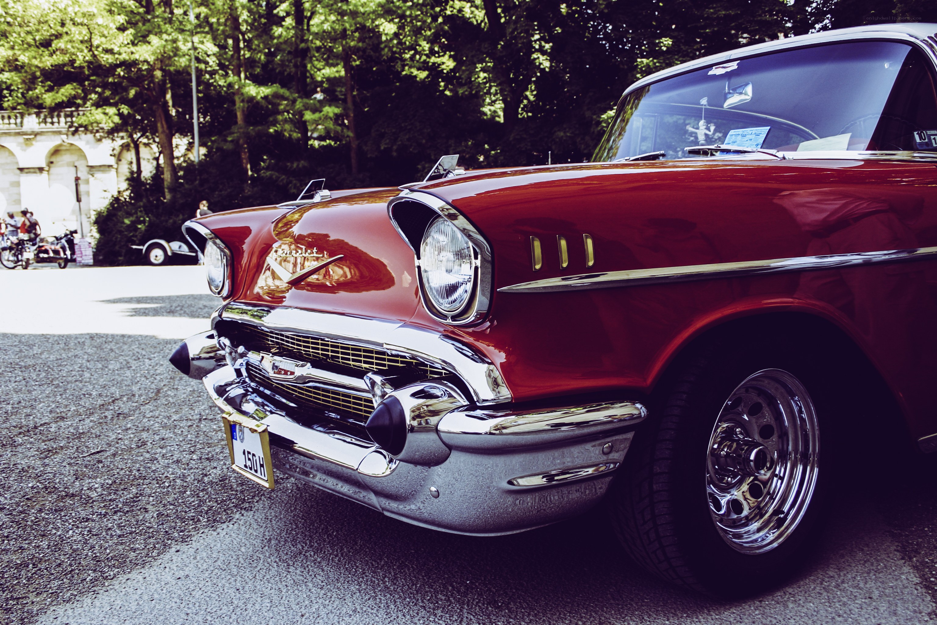 Red classic car at outdoor event