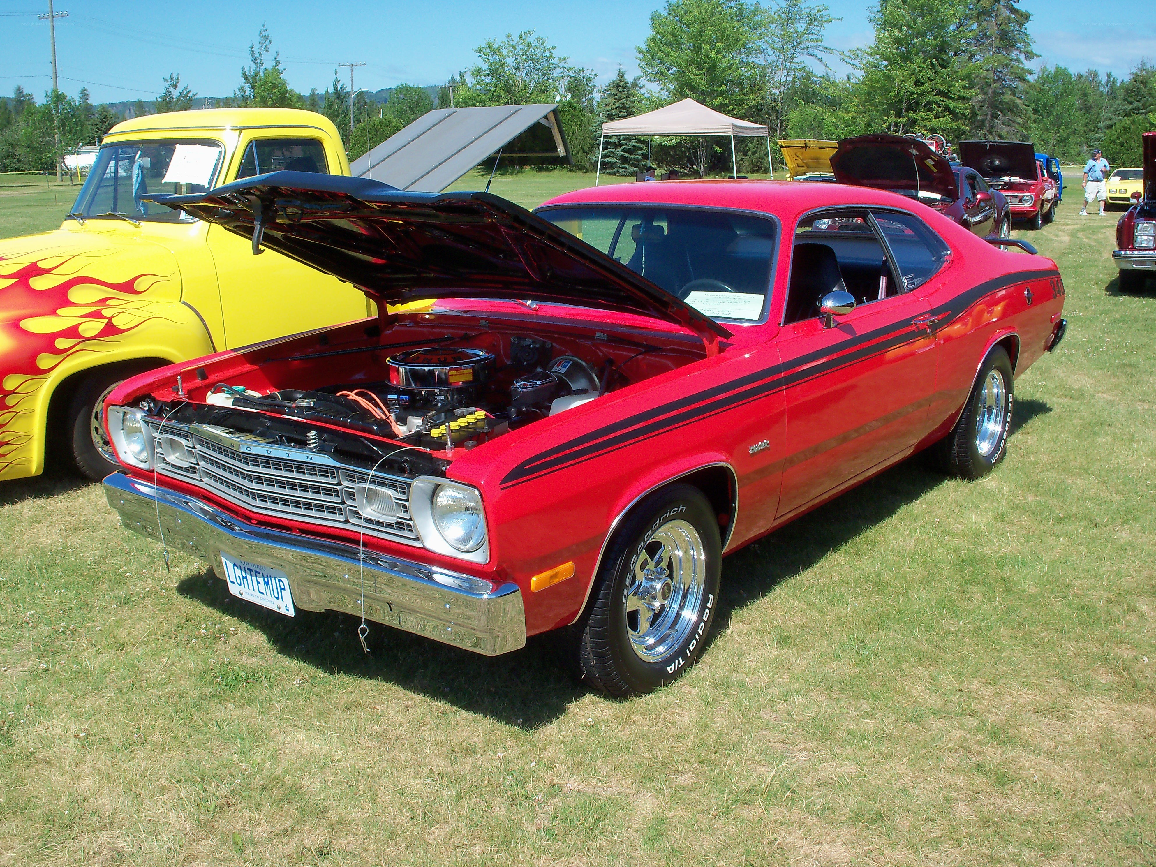 Red classic car at outdoor show