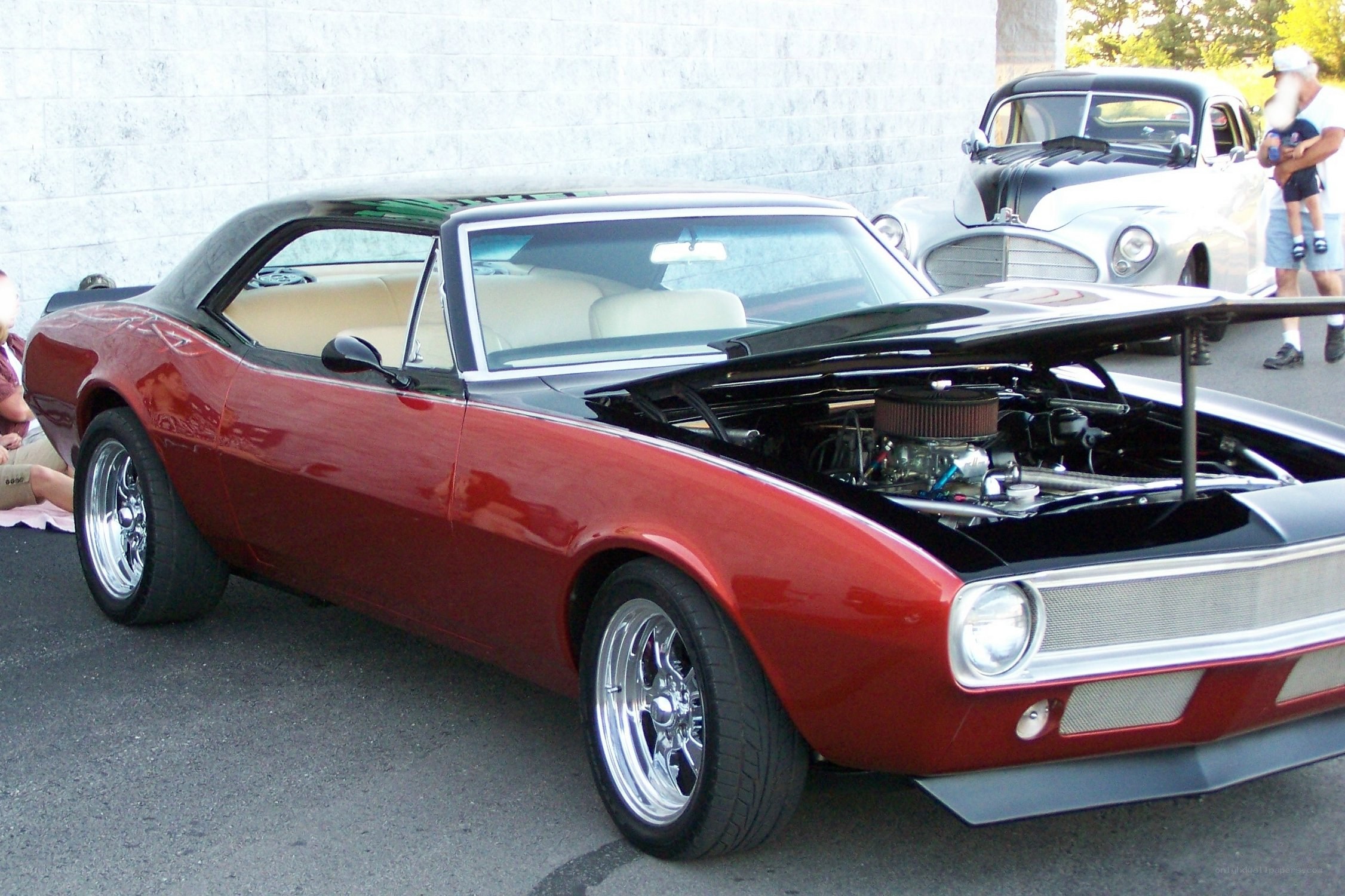 Red classic car at show