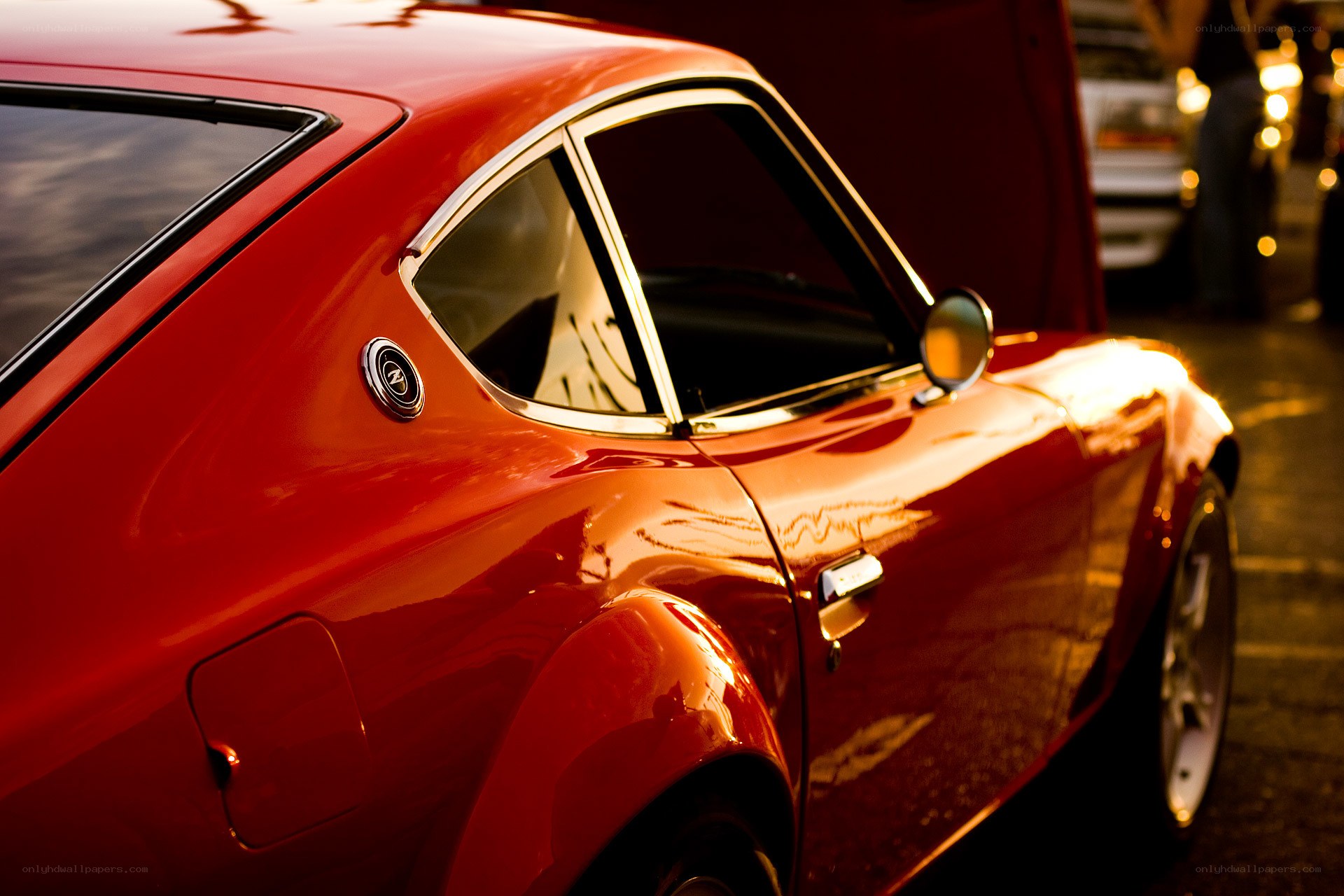 Red classic car at sunset