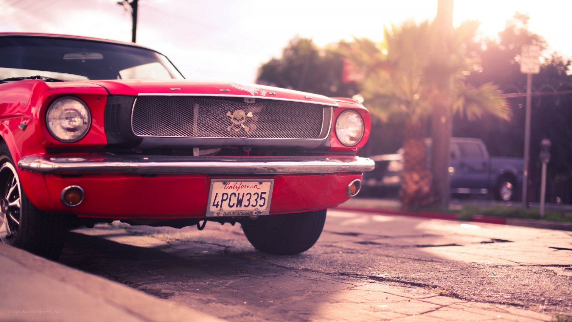 Red classic car at sunset