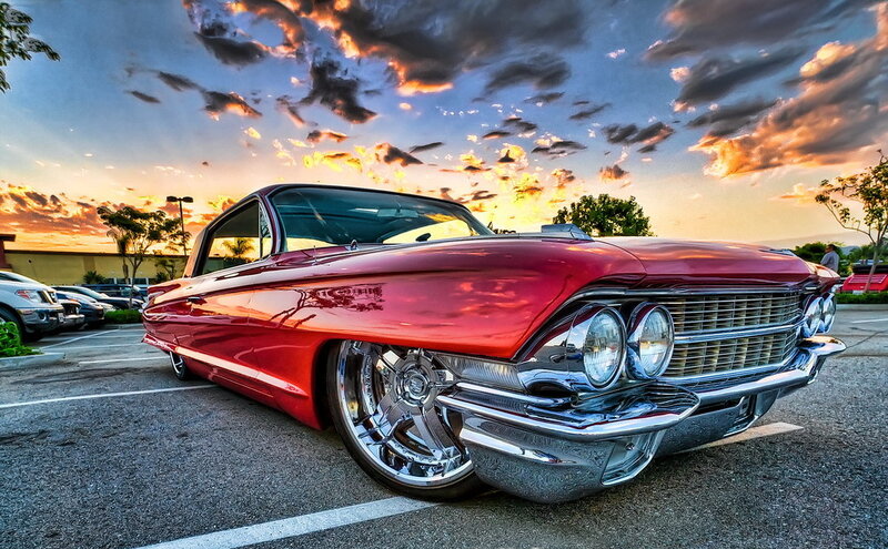 Red classic car at sunset