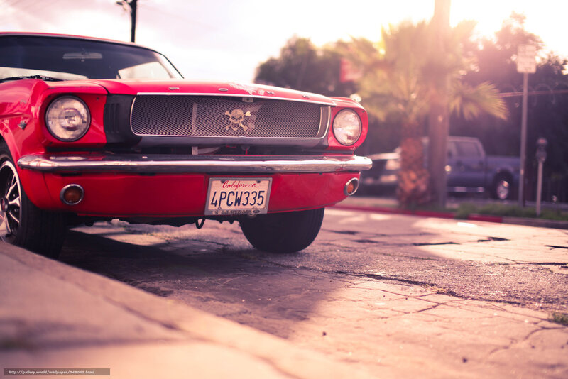 Red classic car at sunset