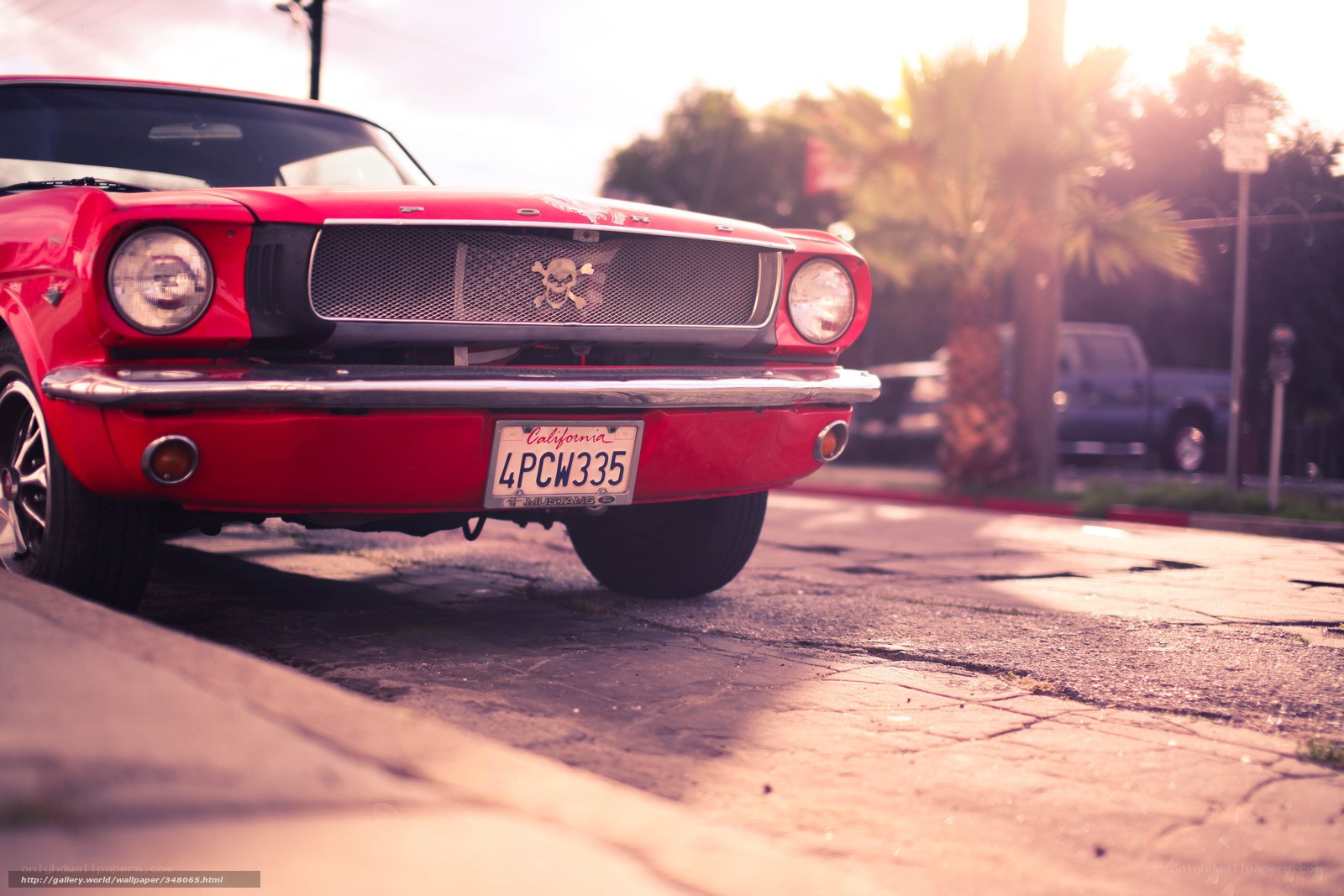 Red classic car at sunset