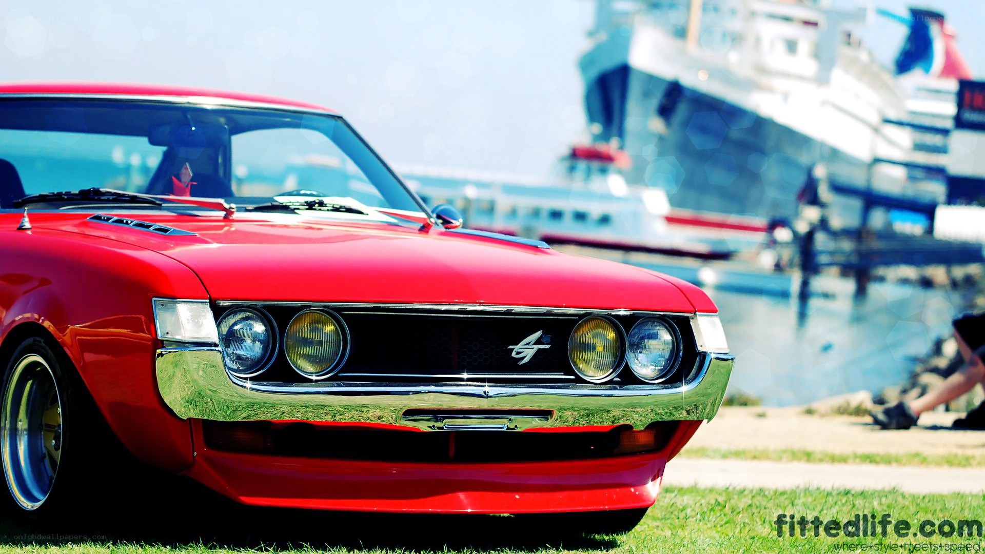 Red classic car at the harbor
