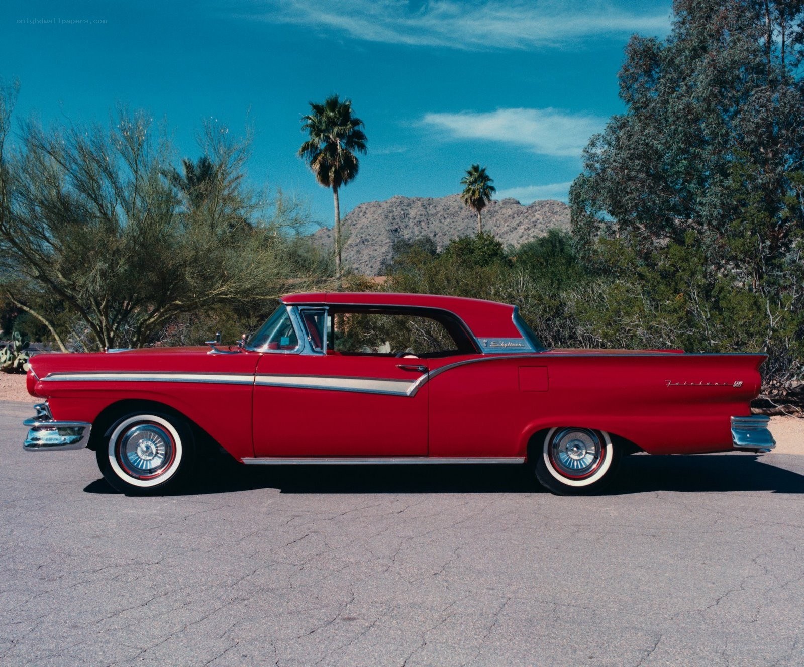 Red classic car in desert