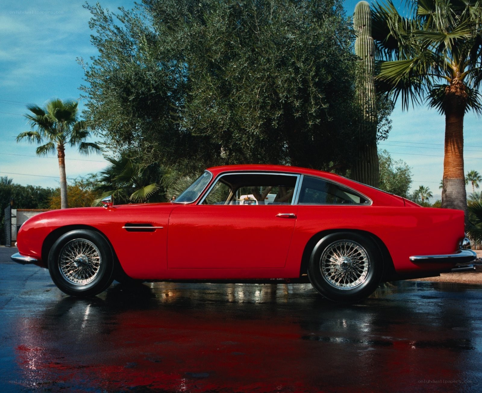 Red classic car in desert setting